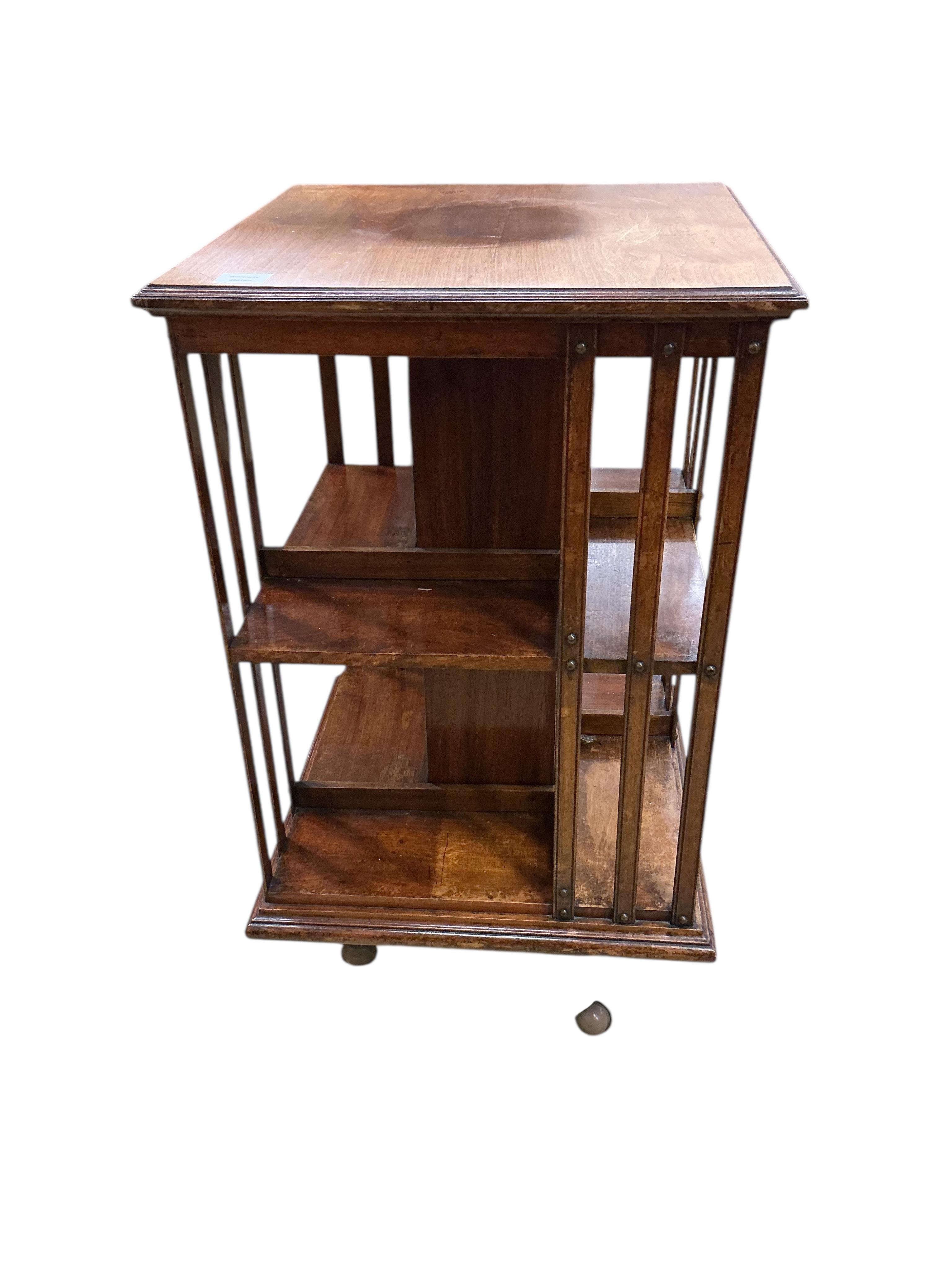 A late Victorian walnut revolving bookcase, width 52cm, depth 52cm, height 91cm